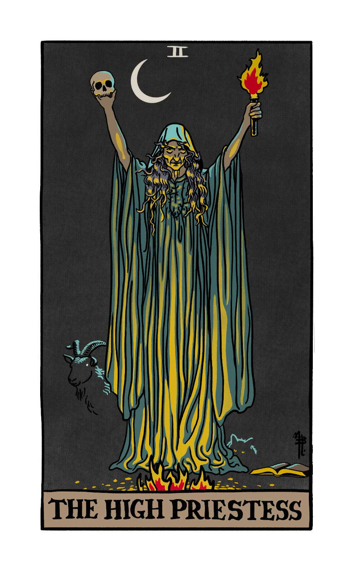 The Legend of Sleepy Hollow Tarot—Headless Horseman Edition by Schiffer Publishing, Ltd. features The High Priestess: a robed woman with skull and torch, crescent moon overhead, flames at her feet, a goat nearby, and Roman numeral II atop the card.
