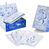 The Bleu Cat Tarot by Schiffer Publishing, Ltd. is shown in a light blue box with a stylized cat; whimsical cat tarot cards are spread in front while the deck remains partially inside the open package.