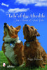 A corgi and a terrier sit on grass under a blue sky. The book title is "Tails of the Afterlife" by Schiffer Publishing, Ltd., featuring true pet visitation stories. The Schiffer Publishing, Ltd. logo appears in the bottom left corner.