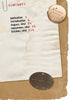 A vintage contents page for "Stalingrad: The Death of the German Sixth Army on the Volga, 1942-1943" by Schiffer Publishing, Ltd. lists sections with red numbers, while relics like a dog tag and badge from the Sixth Army rest on its worn paper.