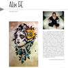 A magazine page showcases TattooIsMe 2 by Schiffer Publishing, Ltd.: on the left, a stylized tattoo of a woman’s face with flowers and bold lines; on the right, a portrait of tattoo artist Alix GE seated on a white chair with biographical text below.