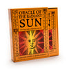 Two orange boxes of the Oracle of the Radiant Sun astrology deck by Schiffer Publishing, Ltd., featuring a stylized sun face and astrological symbols on the cover.