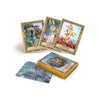 A spread of illustrated tarot cards from Schiffer Publishing, Ltd.’s Secret Woods deck shows whimsical animal characters—three upright, one facedown—with a stacked deck displaying decorative backs on a white background.