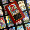 A red box labeled The Buddha Tarot by Schiffer Publishing, Ltd. rests on vibrant tarot cards, each adorned with Buddhist-inspired art, Major Arcana themes, and symbols reflecting the journey to enlightenment.