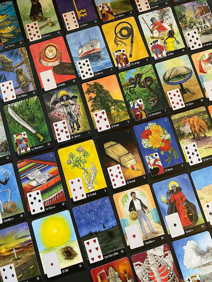 The La Santa Muerte Lenormand by Schiffer Publishing, Ltd. features colorful divination cards with unique illustrations and playing card symbols, each numbered and arranged in a grid pattern on a flat surface.