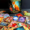 The Lenormand of Enchantment deck and guidebook by Schiffer Publishing, Ltd. features a fox on the cover, with vibrant illustrated cards displayed on a dark surface.
