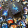 The Higher Self Oracle by Schiffer Publishing, Ltd. is spread out on a black surface, showing vibrant illustrations and words like Change, Balance, and Boundaries from this spiritual guidance oracle deck.