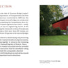 Pennsylvania's Covered Bridges by Schiffer Publishing, Ltd. depicts a red covered bridge with a white roof crossing a stream, green grass and trees around it, plus a stone wall and steps leading to the entrance under a clear sky.