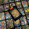 A vibrant display of Bonefire Tarot cards by Schiffer Publishing, Ltd. features colorful, hand-painted illustrations. The deck’s box displays a golden pentacle, resting atop scattered cards filled with expressive, mystical imagery.