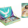 The Christ Consciousness Self-Mastery Oracle by Schiffer Publishing, Ltd. is shown boxed and open, with cards featuring a white dove and illustrated Jesus with a glowing heart—imagery inspiring spiritual growth.