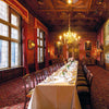 Experience the timeless grandeur of historic castles with "At Home with Royalty" from Schiffer Publishing, Ltd.—an elegant look at formal dinners in ornate rooms adorned with chandeliers, red walls, and grand tapestries.