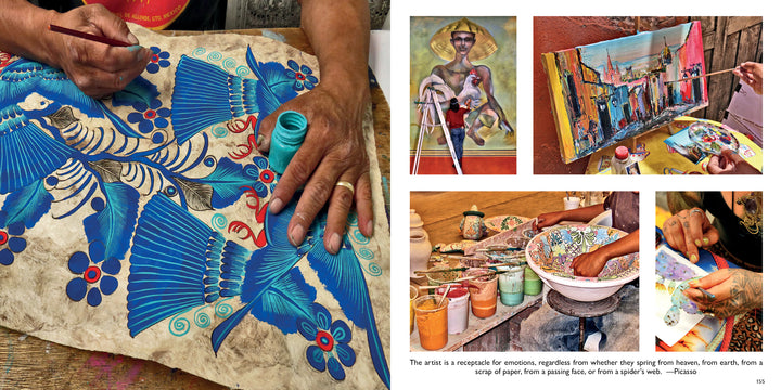 A close-up of hands painting a vibrant blue bird on parchment, surrounded by artists and colorful artworks—like a page from "San Miguel de Allende" by Schiffer Publishing, Ltd.