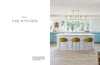 Modern kitchen with a white island, green barstools, light blue cabinets, and bright windows—ideal for inspiration. On the left: “Chapter 7 THE KITCHEN.” Featured in "It's All in the Mix" by Schiffer Publishing, Ltd.