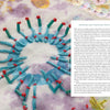 A close-up of The Cumulative Cloth, Dry Techniques by Schiffer Publishing, Ltd. shows blue thread and green beads in a circle with red-tipped pins on fabric, plus partly visible printed text about inventing and composing custom dry textile surface design.
