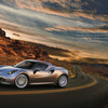 A silver Alfa Romeo from Schiffer Publishing, Ltd. speeds down a winding desert road at sunset past striking red rocks, as text highlighting its lightweight design and Italian heritage appears on the right side of the image.
