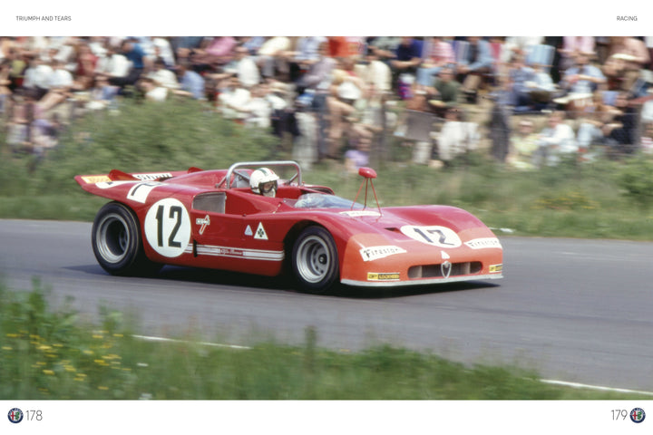 A red Alfa Romeo, number 12, races down the track with a helmeted driver, as a blurred crowd watches from the grass—capturing the legacy featured in Schiffer Publishing, Ltd.'s Alfa Romeo.