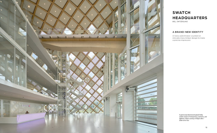 The spacious lobby at Swatch Headquarters showcases mass timber lattice patterns, as seen in "Innovations in Mass Timber" by Schiffer Publishing, Ltd., demonstrating the environmental benefits of timber in commercial interiors.