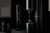 Three copies of "The Art of Luxury Design" by Schiffer Publishing, Ltd. are displayed against a dark background, their elegant covers reflecting the sophisticated aesthetics of high-end architecture and luxury living.