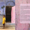 A young girl in yellow stands by a painted purple wall with a cartoon deer and pink cloth. "The Pigment Trail" by Schiffer Publishing, Ltd. celebrates Indian festival colors; related text is displayed on the right.