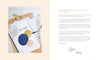 A flat lay of drawing tools, paper, and a minimalist embroidery design from “Stitch with One Line” by Schiffer Publishing, Ltd., with overlapping colorful circles and wavy stitches—ideal for beginner embroidery projects.
