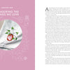 A spread from Threads of Treasure by Schiffer Publishing, Ltd. shows a pink left page titled Chapter Two: Treasuring the Things We Love, with modern embroidery—a strawberry on denim—and black serif text about caring for cherished clothing.