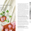 In "Threads of Treasure" by Schiffer Publishing, Ltd., see how modern crafters patch holes and decorate cream garments with green vine and orange fruit embroidery, shown in detailed close-ups of creative mending stitches on light fabrics.