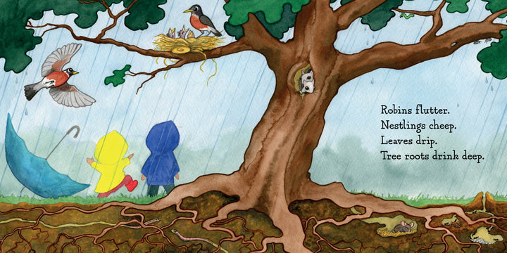 Two kids in yellow and blue raincoats stand under a tree in the rain, watching a robin’s nest as roots spread and a squirrel peeks out. "Hello, Rain!" by Schiffer Publishing, Ltd. is a wonderful children’s book for exploring nature and rainy days.