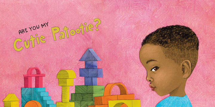 A child with short curly hair and a blue shirt looks to the side in front of colorful blocks. Above, "Are You My Cutie Patootie?" by Schiffer Publishing, Ltd. is written—a sweet board book for diverse families—on a pink textured background.