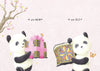 Two pandas stand side by side; the left, holding a shiny gift, says “I am NEW!” and the right, with a faded box, says “I am OLD.” A charming picture from "The Magic Box" by Schiffer Publishing, Ltd., for emerging readers, with blossoms and butterflies.