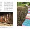 A page from "Marking Time with Fabric and Thread" by Schiffer Publishing, Ltd. shows two vibrant fiber art images: a tapestry in a gallery and another as a winding path outdoors, both accompanied by text.