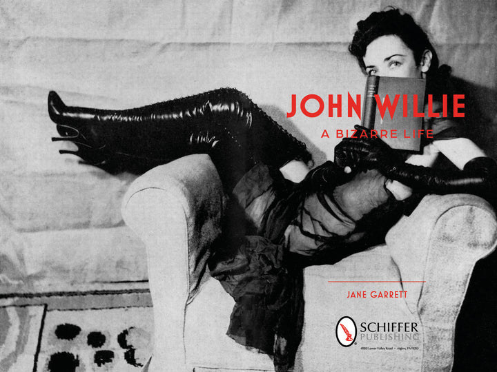 Black and white photo of a woman in thigh-high boots and gloves reclines on an armchair. Red text reads John Willie, spotlighting the legendary fetish artist. Jane Garrett and Schiffer Publishing, Ltd. appear below.