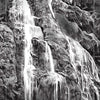 Black and white illustration of a cascading waterfall over rocks with a tarot card style border, labeled "7. THE CASCADE," from The Bloodlands Oracle by Schiffer Publishing, Ltd., a nature-inspired oracle card deck.