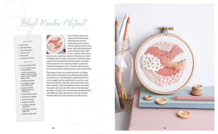 Cozy Stitches by Schiffer Publishing, Ltd. is a pastel abstract embroidery kit for beginners. It features blush, white, and peach threads on white fabric in a wooden hoop—perfect for slow stitching and easy crafting.