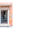 Two photos on the left show Venetian doors: one with windows by a canal featuring a person inside, the other with a rustic entryway in a peach wall. On the right, “Author’s Note” block. From "Doors of Venice" by Schiffer Publishing, Ltd.