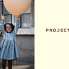 A young girl in a blue dress smiles, holding a large orange balloon against an urban backdrop with "PROJECTS" on a cream panel, inviting kids to explore Schiffer Publishing, Ltd.'s Magical Crochet for imaginative patterns and fun accessories.