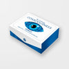 A rectangular white and blue box for The Unifying Consciousness Tarot by Schiffer Publishing, Ltd. features a stylized blue eye on the lid with the title above it. The box is placed on a plain light surface.