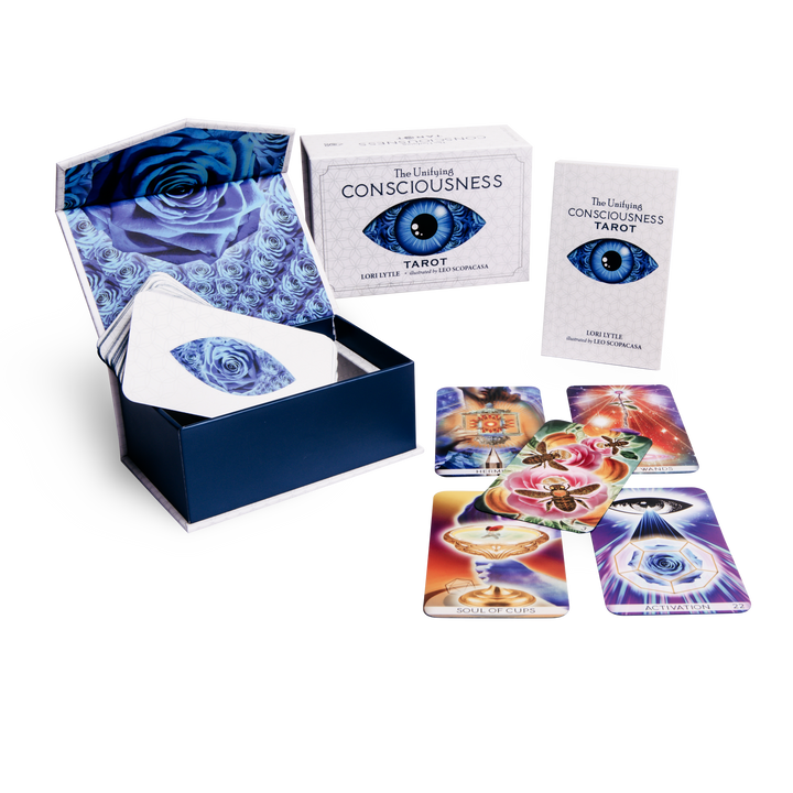 The Unifying Consciousness Tarot by Schiffer Publishing, Ltd. is shown with an open box featuring a rose and eye design, a guidebook, and colorful Rider-Waite-Smith-inspired cards spread out.