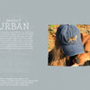A woman in a blue cap with a cheetah patch, inspired by The Field Guide to Embroidery from Schiffer Publishing, Ltd., nuzzles a brown dog among autumn leaves outdoors. Urban ecosystem text is shown on the image's left side.