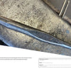 A close-up of a metal punch tool on an anvil, ideal for blacksmithing. With its slender, curved shape and textured finish, it’s perfect for any beginner using "Contemporary Blacksmithing for Beginners" by Schiffer Publishing, Ltd. Partial text below.