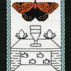 The Butterfly Wisdom Tarot by Schiffer Publishing, Ltd. features a red and black butterfly above flowers and a cup, with four fish below. The KING OF CUPS card symbolizes transformative healing.