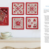 Five red and beige quilt squares inspired by Japanese quilting from "Kawaii Appliqué Quilts from Japan" by Schiffer Publishing, Ltd. hang above a white shelf with a pale green teacup; materials and project info are shown to the right.