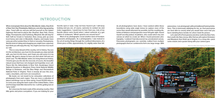 A pickup truck adorned with stickers is parked along a scenic route from "Back Roads of the Mid-Atlantic States" by Schiffer Publishing, Ltd., surrounded by vibrant autumn trees and perfect for landscape photography under an overcast sky.