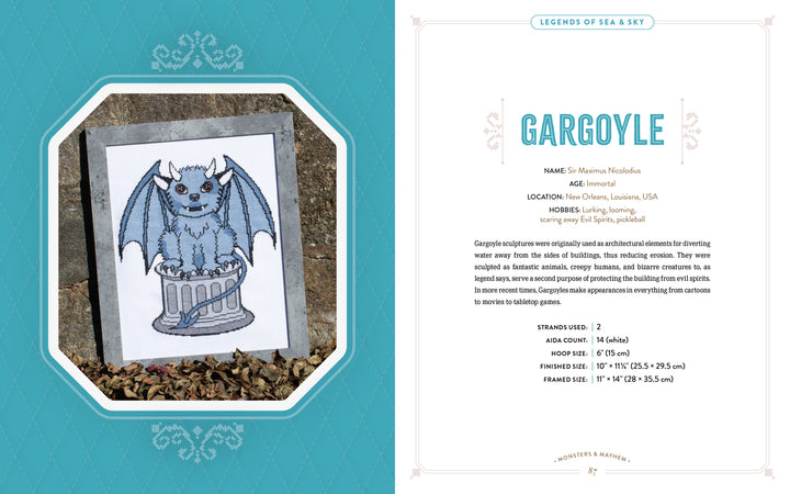 A cross-stitched blue gargoyle with wings sits on a column outdoors, inspired by fantasy and mythical beasts. Shown with character info from "Monsters and Mayhem in Cross-Stitch" by Schiffer Publishing, Ltd.
