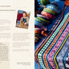 A woman demonstrates traditional weaving for "Fiber Craft Heritage" by Schiffer Publishing, Ltd., creating vibrant blue, red, and yellow patterned bands, with finished pieces and crafting tools displayed on a table.