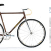 A brown Handcrafted Bicycles bike by Schiffer Publishing, Ltd. is shown sideways on a white background, with yellow handlebar tape and silver parts. Text about Philadelphia craftsmanship appears on the right.