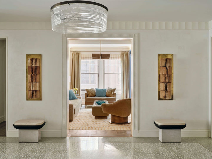 A modern living room with neutral walls, wood accents, and stylish seating—ideal inspiration for residential design projects—featured in "PowerHouse" by Schiffer Publishing, Ltd.