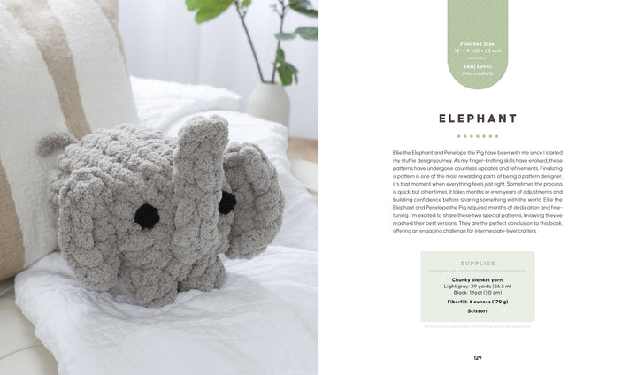 A plush gray crocheted elephant with black button eyes sits on a white bedspread near pillows. On the right, Schiffer Publishing's "Get Started in Finger Knitting" shows instructions and supplies for making the elephant with chunky yarn.