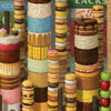 Whimsical towers of colorful donuts, cakes, cookies, and apples evoke Robert C. Jackson’s realistic still-life style in this Schiffer Publishing, Ltd. release, set against vintage soda crates with vibrant textures and rich frosting.
