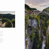 Experience Alpine Railways by Schiffer Publishing, Ltd.: a red train crosses a towering stone viaduct over a wooded gorge, mountains and forests all around, offering one of the most scenic routes in the European Alps beneath cloudy skies.