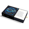 A partially open black box labeled "The Law of One Contemplation Deck" by Schiffer Publishing, Ltd. displays a cosmic blue design, a card with Ra quotations, and a gold ribbon tab for easy access.